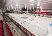 Hockey Etcetera's main ice surface with seating for fans on the left